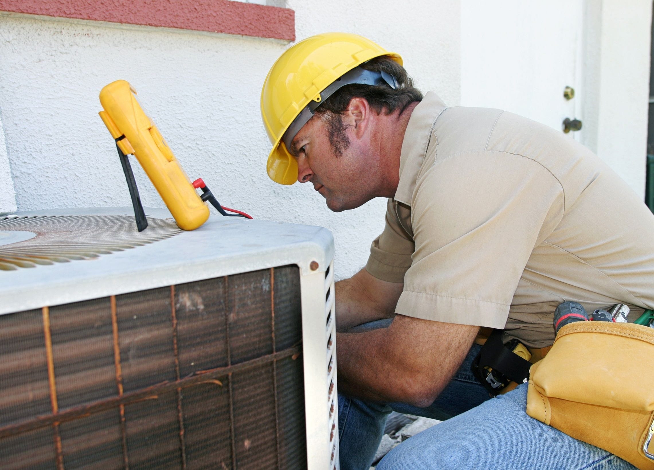 Heating system repairs being performed by a technician