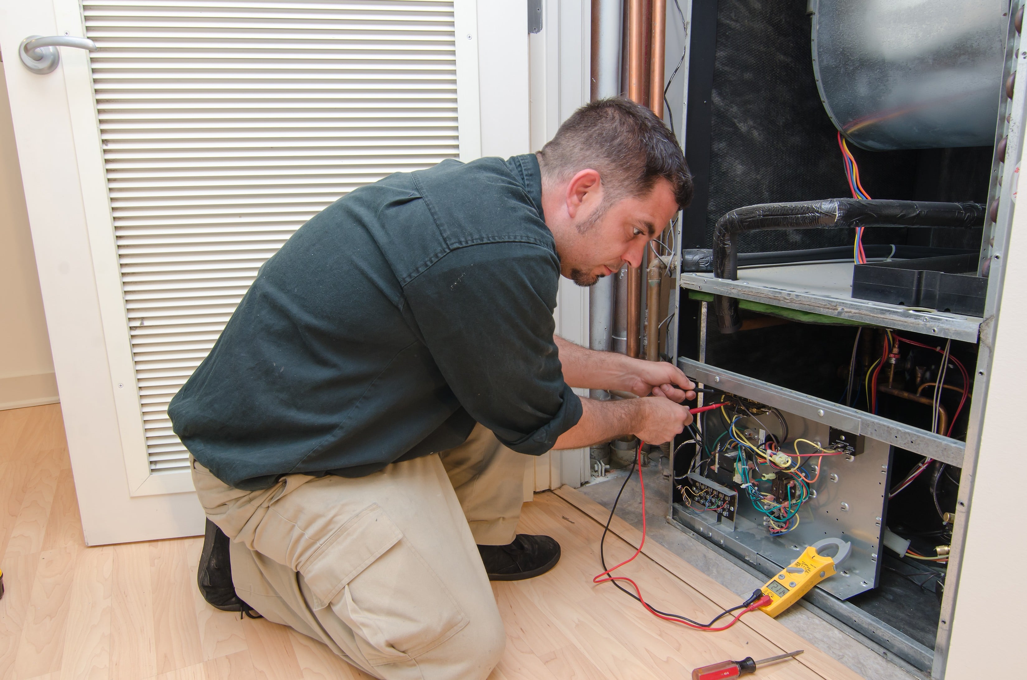 heating service or repair being performed by a technician